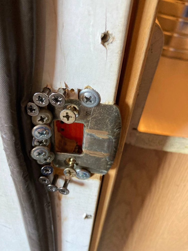A keep held on with a crowd of extra screws